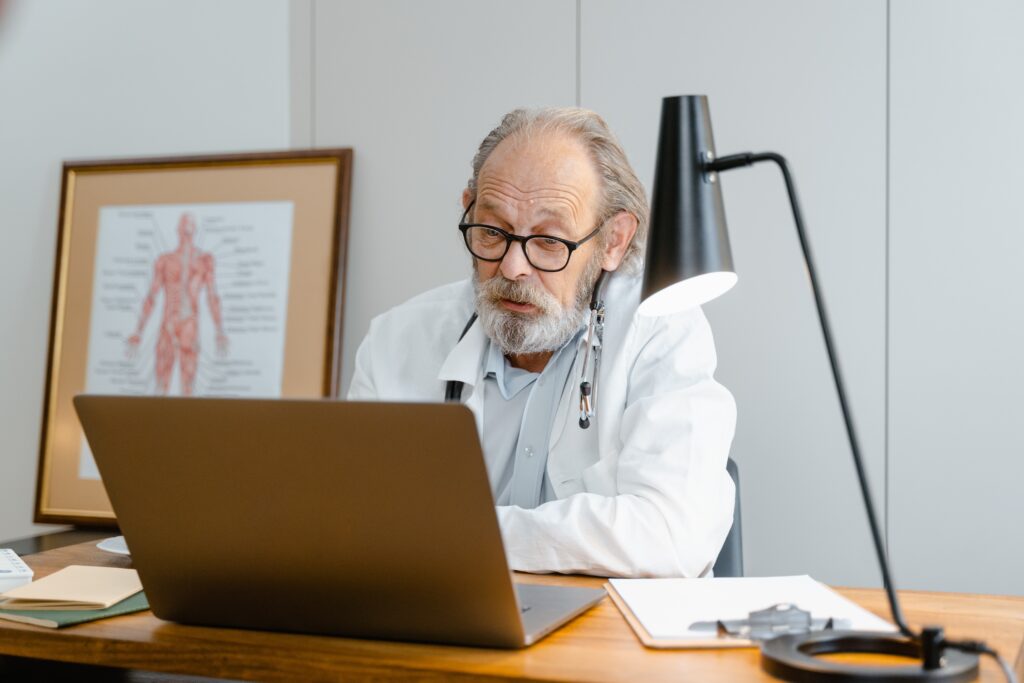 Doctor in front of a laptop